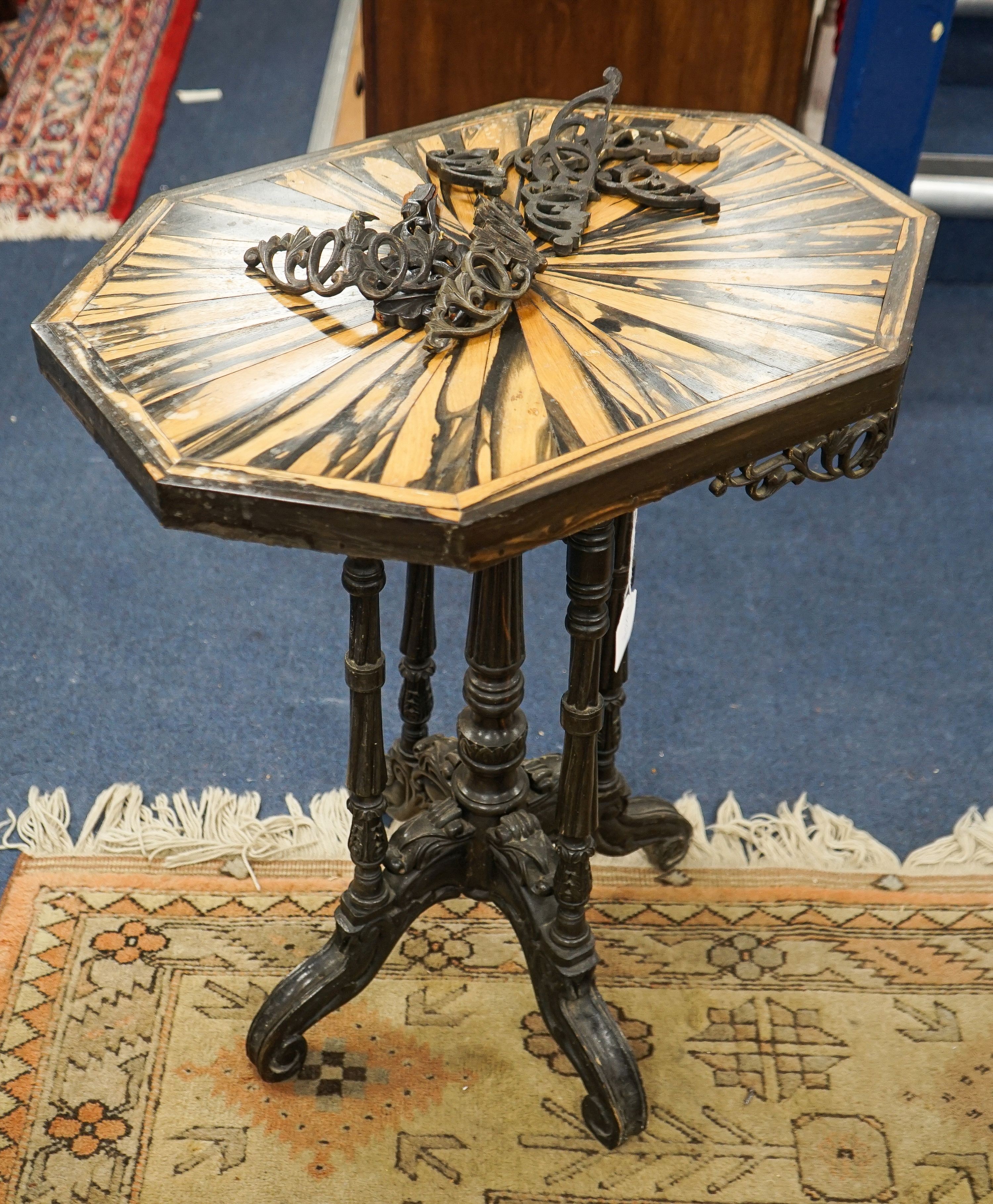 A 19th century Celanese carved ebony and coromandel veneered octagonal occasional table, width 57cm, depth 42cm, height 70cm